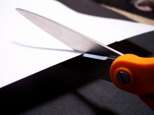 Scissors cutting paper